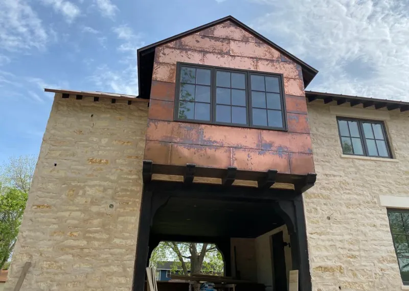Copper metal panel facade on a stone building for Metal Roof Coating in Affton