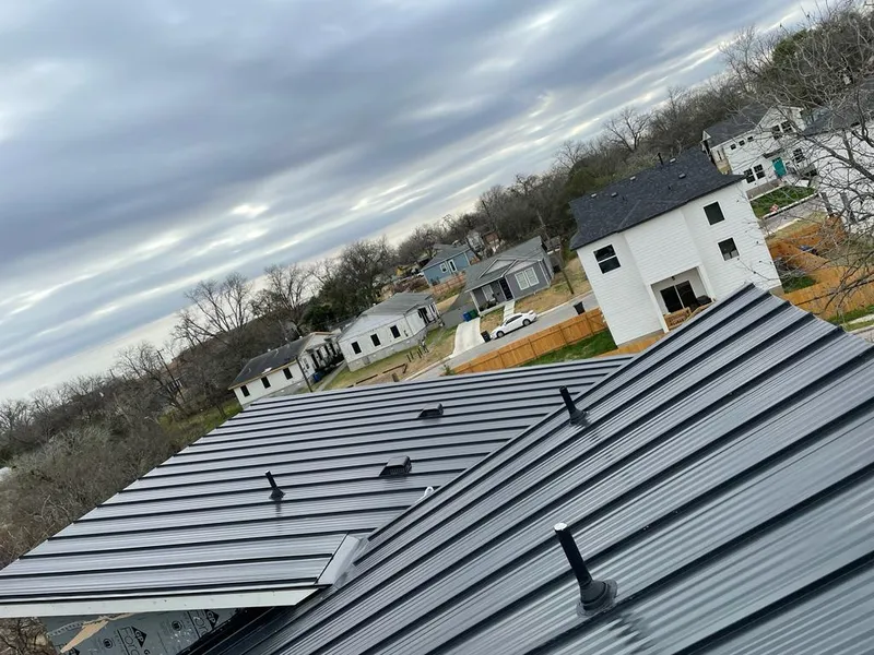 Standing seam metal roof panels with vents for Skylight Repair in Affton